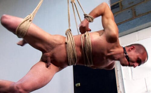 Suspended Slave gets his tight hole fucked