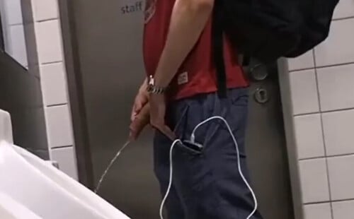 Dude with extremely big dick caught peeing at urinals