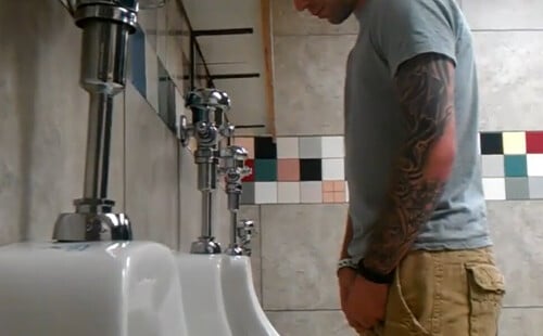 Handsome dude caught by spycam while peeing at urinal