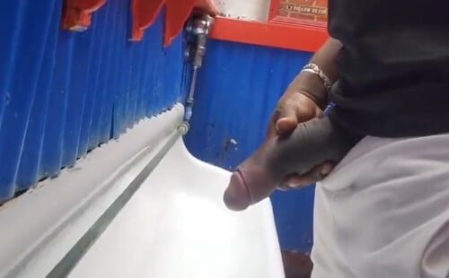 Dude with big black dick caught peeing at urinals