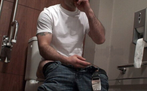 Hot muscular man caught on hidden camera while jerking off in public toilet.