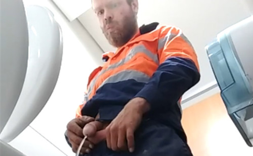 Hot worker caught peeing in public toilet