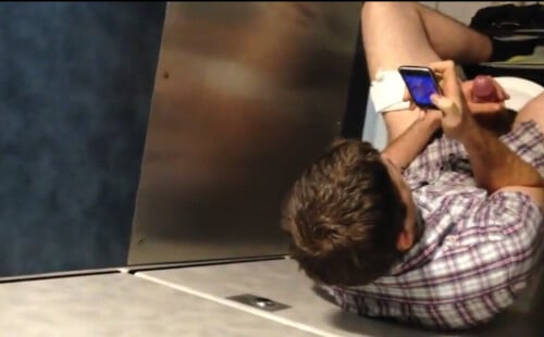 Horny guy caught wanking his big hard dick in public restroom