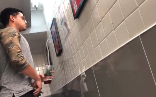 Latin guy caught peeing at the urinals