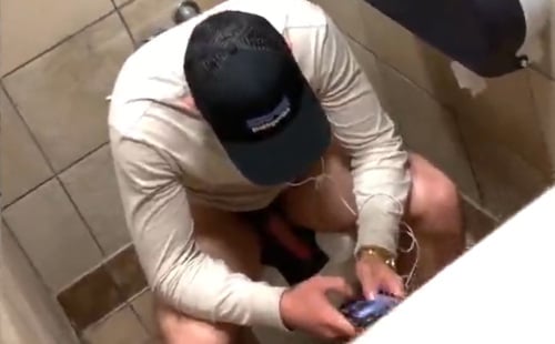 Horny guy jerking off in a public toilet