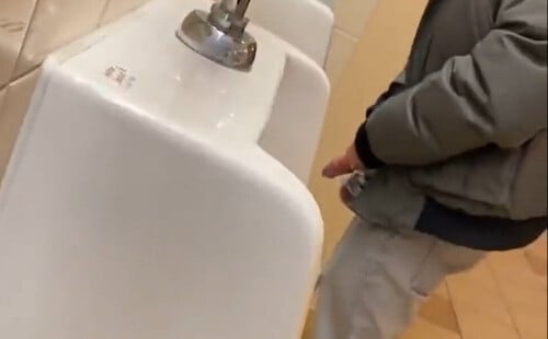 Man with huge cock caught peeing at urinals