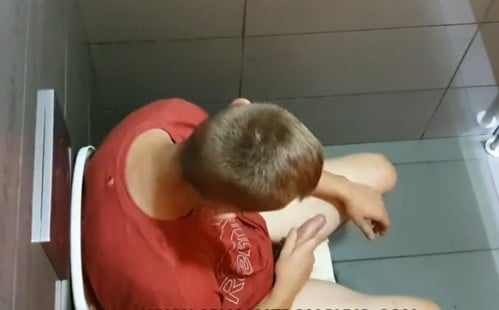 College dude stroking in a public toilet