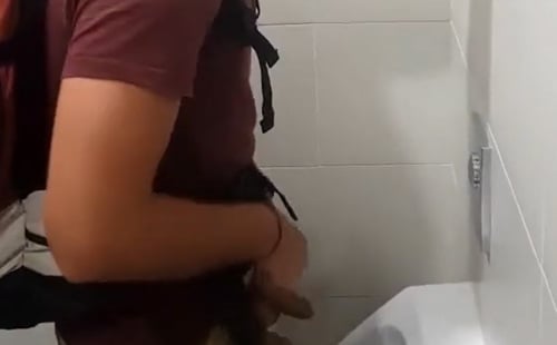 Guy with uncut dick peeing and shaking at the urinal