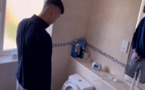 Hung guy caught peeing in the bathroom