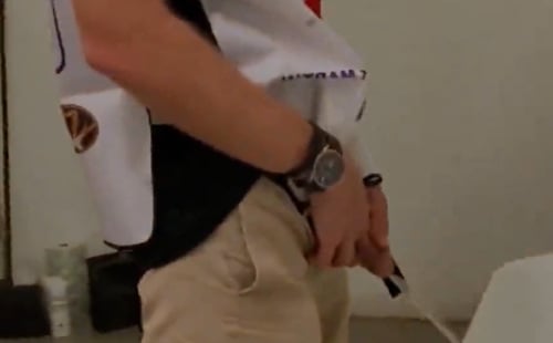 Nice guy peeing at urinal