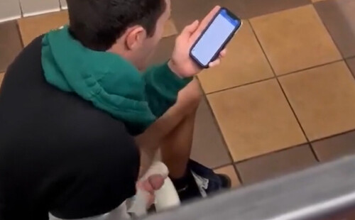 Dude wanking his hard cock in a public toilet