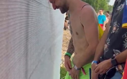 Lots of guys pissing in public at the festival