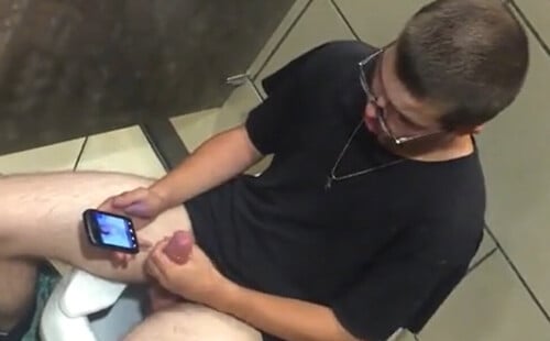 Horny dude caught wanking in a toilet