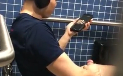 Handsome guy jerking off in public restroom
