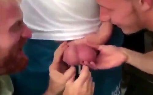 Straight guys playing with the balls of his friend