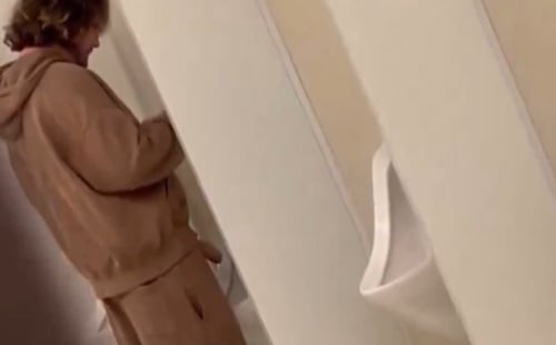 Dude with huge floppy dick peeing at urinal