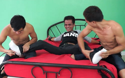 Asian duo tag-team tickle bound guy's feet