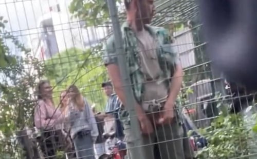 Guy peeing in public at the music festival