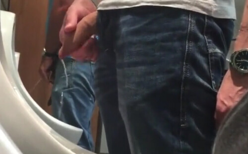 Spy on uncut guy peeing at urinals