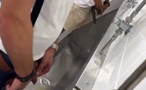 French dude with uncut dick peeing at urinals