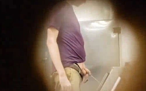 Hung dude caught peeing at urinal