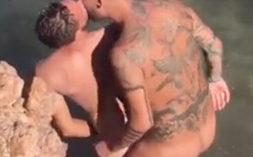 Two nudist guys caught fucking on the rocks