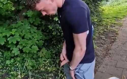Uncut guy pissing outdoor and flaunting his dick